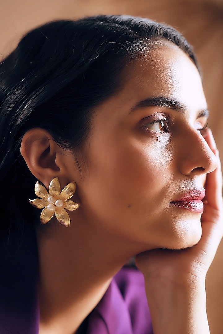 Gold Finish Pearl Handcrafted Stud Earrings by NIHIRAA INDIA