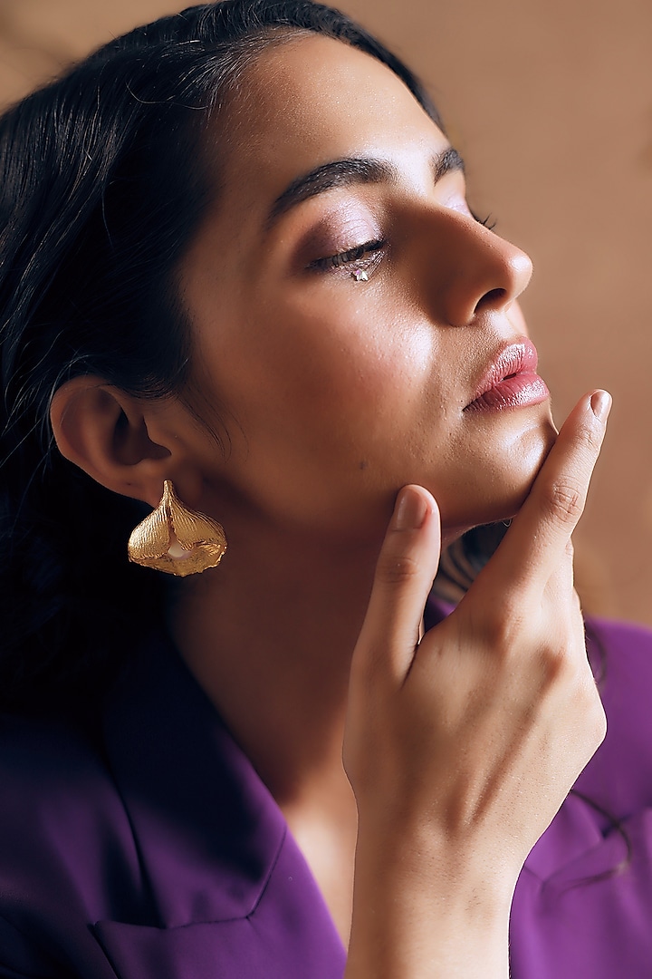 Gold Finish Pearl Handcrafted Stud Earrings by NIHIRAA INDIA