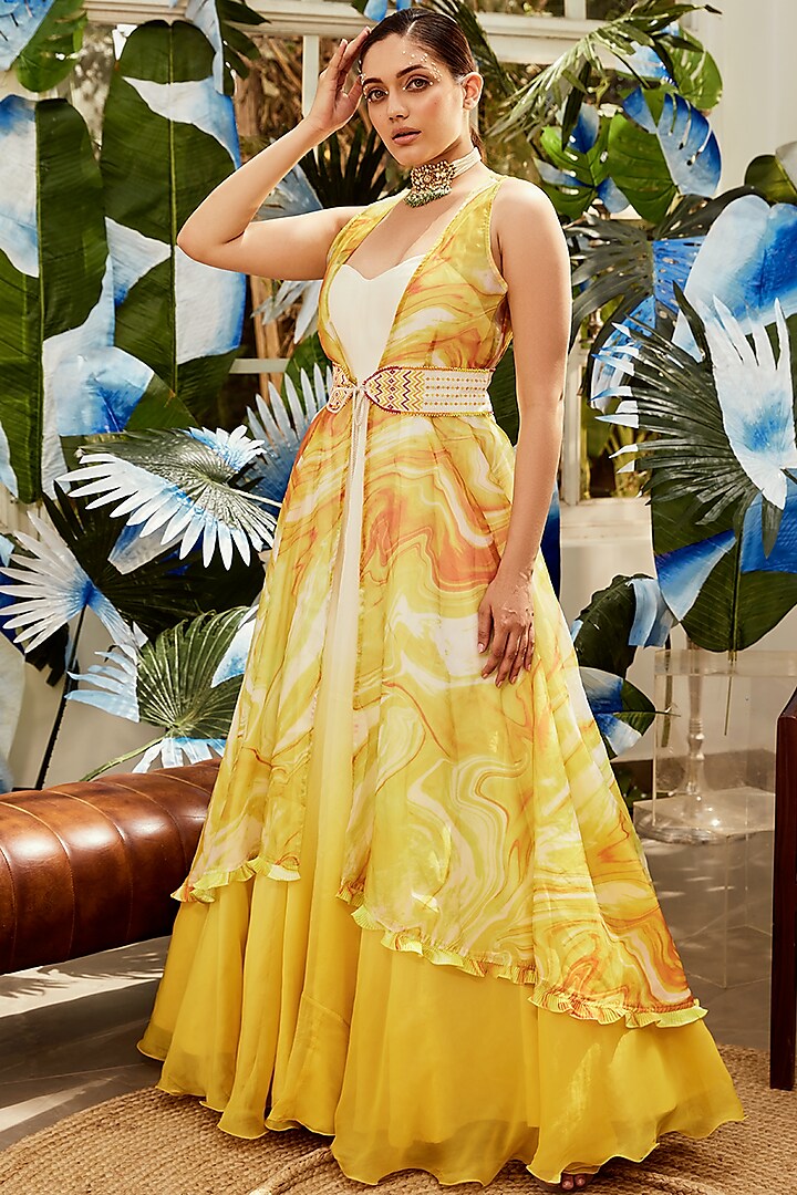 Yellow Organza Gown With Cape by Nikita Vishakha