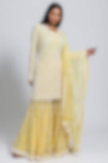 Yellow Net Moti & Cutdana Hand Embellished Flared Sharara Set by NIMA FASHIONS
