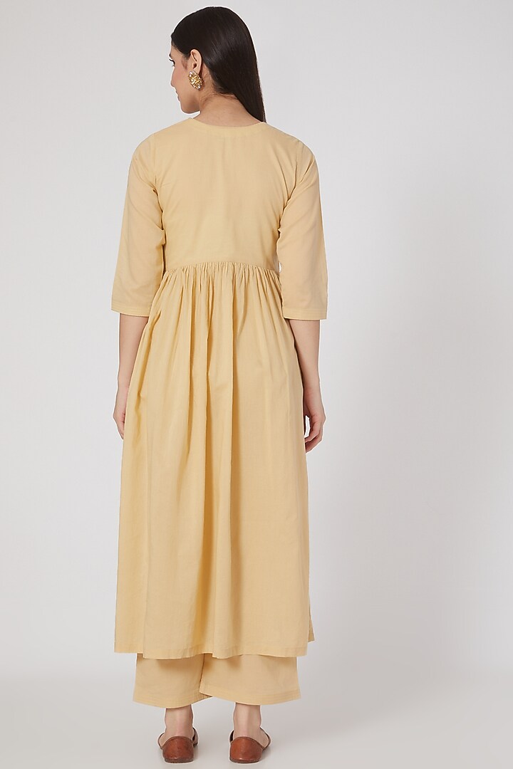 Light Mustard Embroidered Pleated Kurta Set by Nineh at Pernia's Pop Up Shop