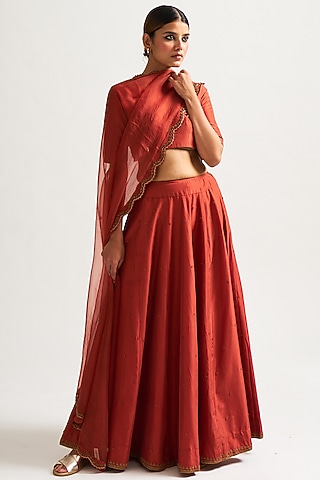 Rust Hand Embroidered Lehenga Set by Nishar Ahmed