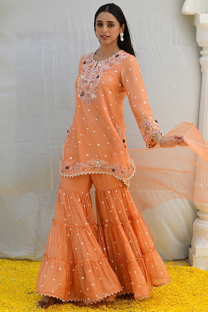 Peach Banarasi Silk Embroidered Tiered Sharara Set by Niti Bothra