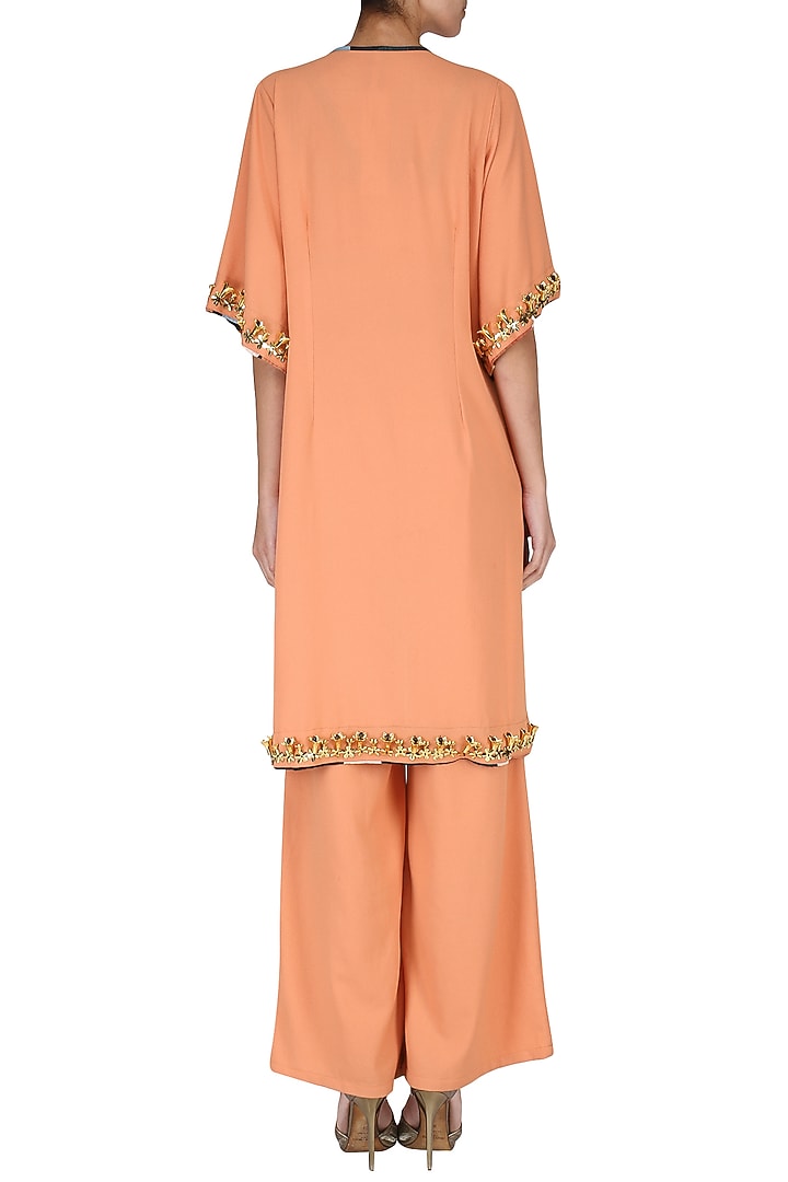 Orange crop top with palazzo pants and embroidered cape set available only at Pernia's Pop Up Shop.