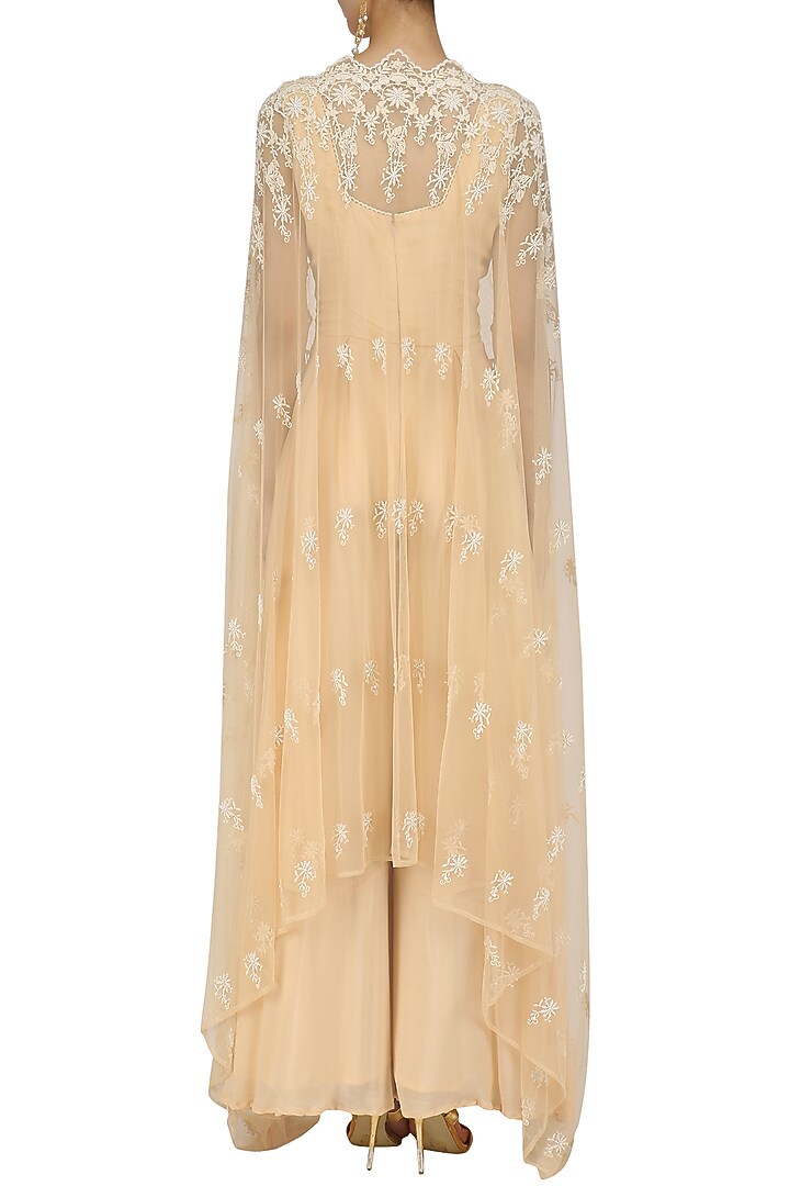 Beige jumpsuit and tulle cape set available only at Pernia's Pop Up Shop.