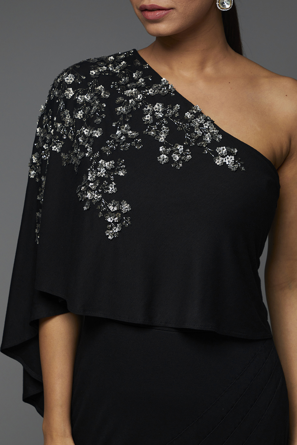 Black Jersey Embellished Off-Shoulder Cape Gown by Namrata Joshipura at Pernia's Pop Up Shop 2025