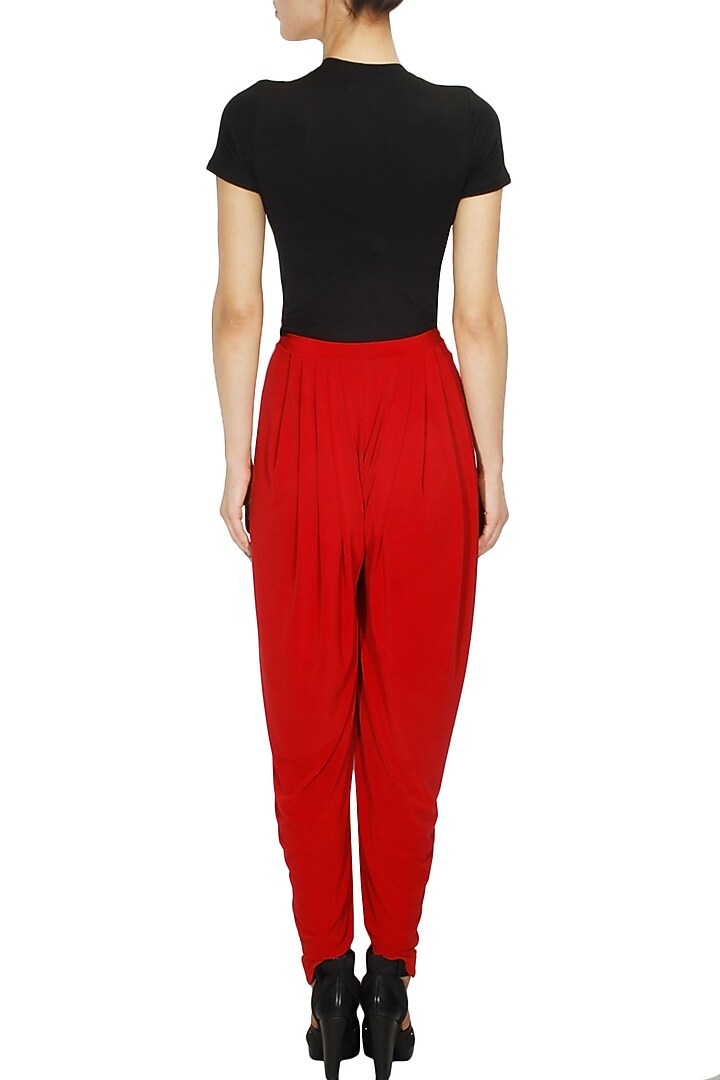 Red pleated jersey dhoti pants available only at Pernia's Pop Up Shop.