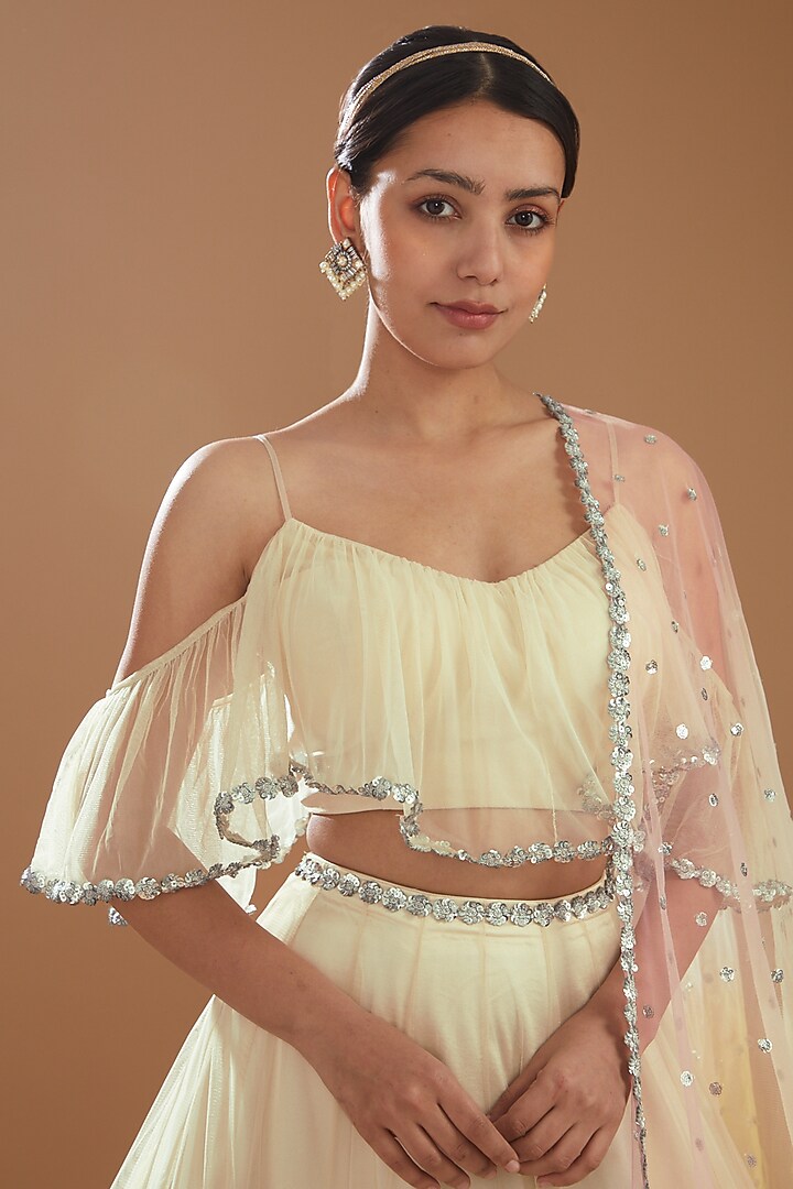 Ivory Raw Silk & Net Wedding Lehenga Set by NITIKA GUJRAL at Pernia's Pop Up Shop