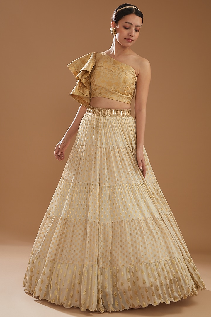 Beige Banarasi Tiered Wedding Lehenga Set by NITIKA GUJRAL at Pernia's Pop Up Shop