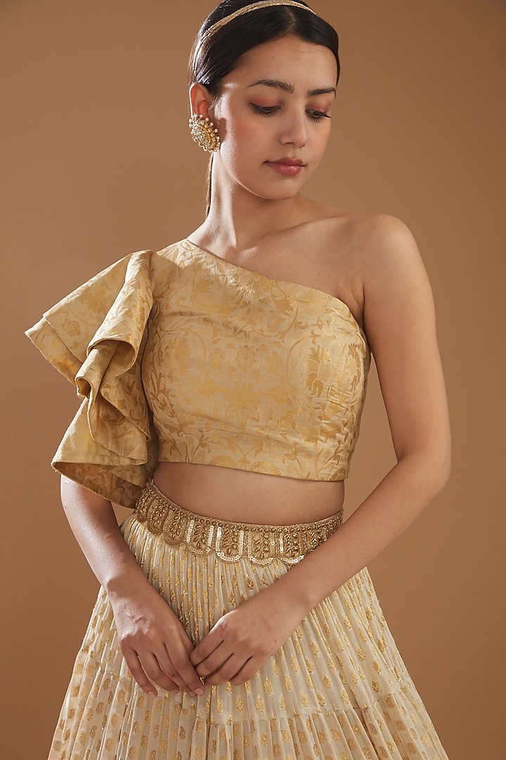 Beige Banarasi Tiered Wedding Lehenga Set by NITIKA GUJRAL at Pernia's Pop Up Shop