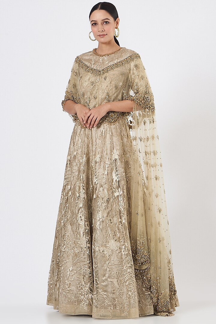 Gold Lace Fabric Gown With Cape by NITIKA GUJRAL