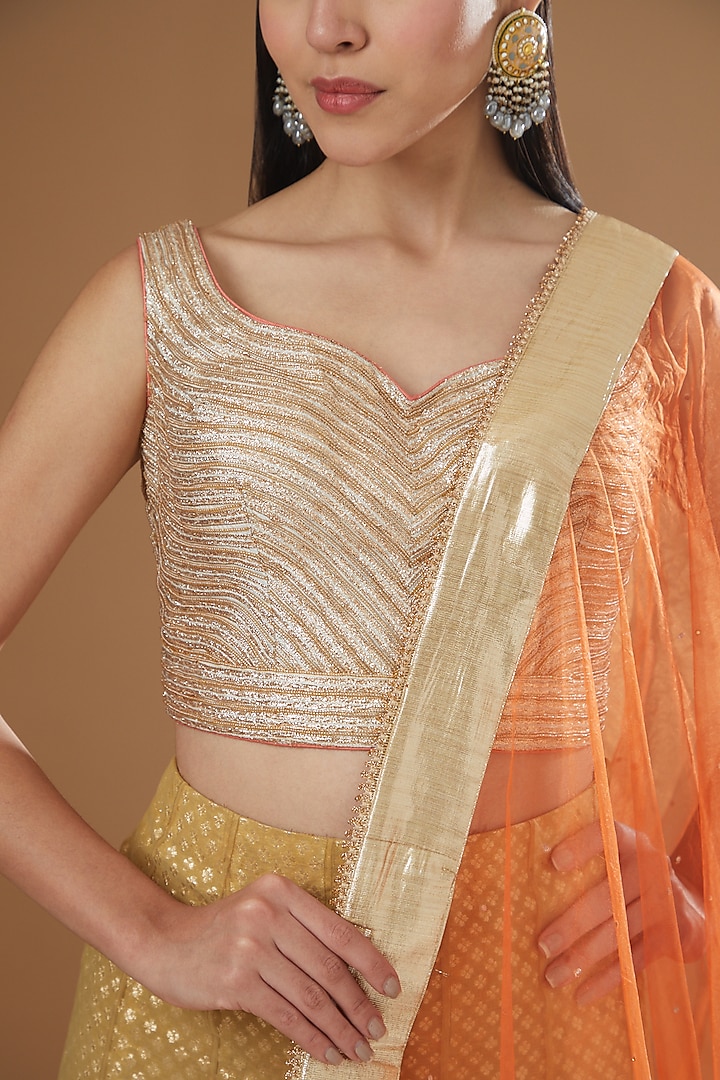 Gold Net Appliqued Embroidered Lehenga Set by NITIKA GUJRAL at Pernia's Pop Up Shop