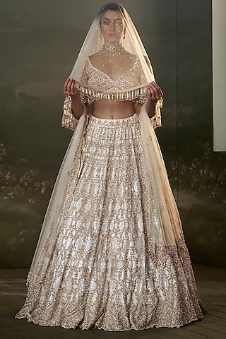 Ivory Net & Satin Sequins Embroidered Lehenga Set by NITIKA GUJRAL