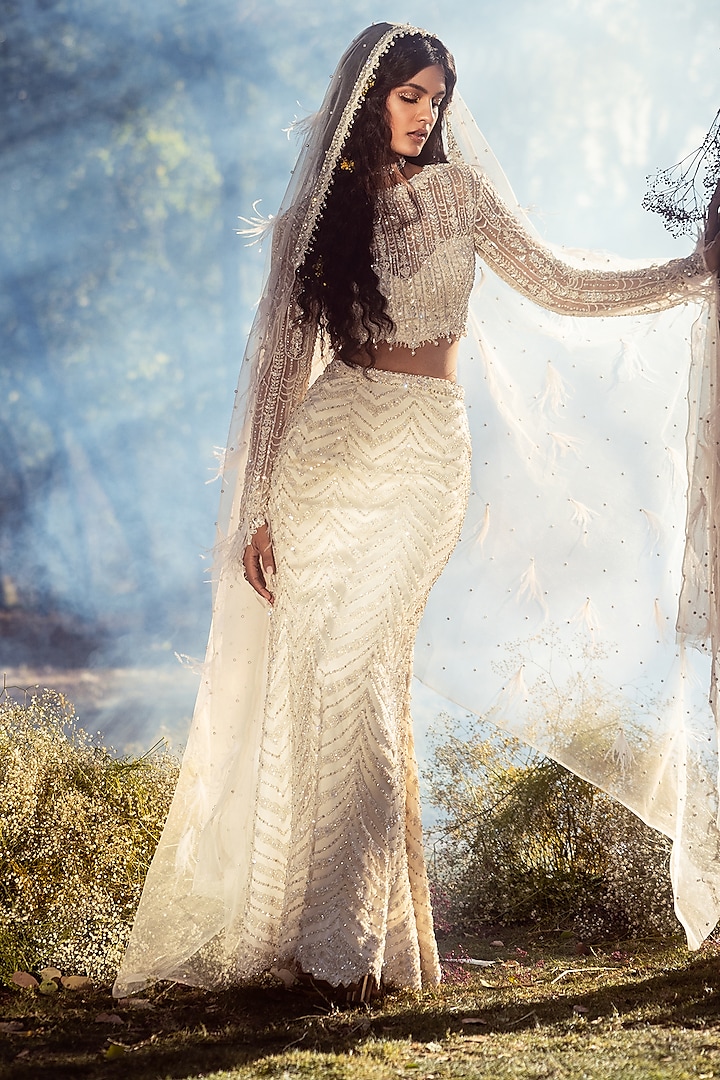 Ivory Net Crystal Embroidered Skirt Set by NITIKA GUJRAL