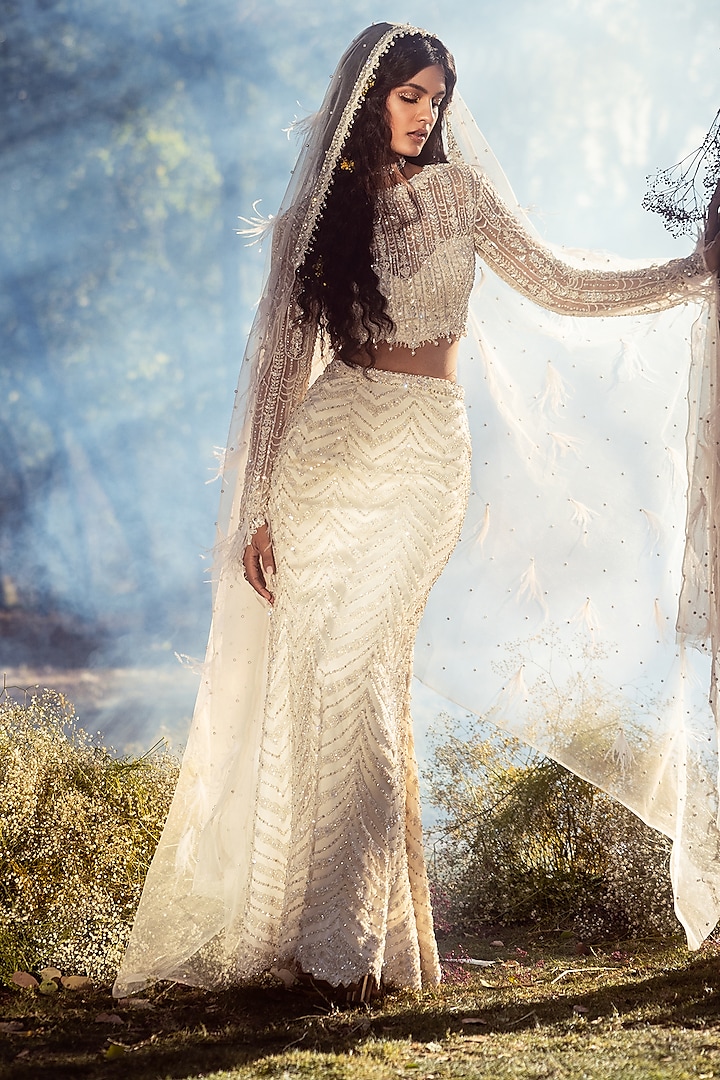Ivory Net Crystal Embroidered Skirt Set by NITIKA GUJRAL at Pernia's Pop Up Shop