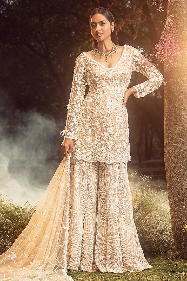 Beige Net Embroidered Sharara Set by NITIKA GUJRAL