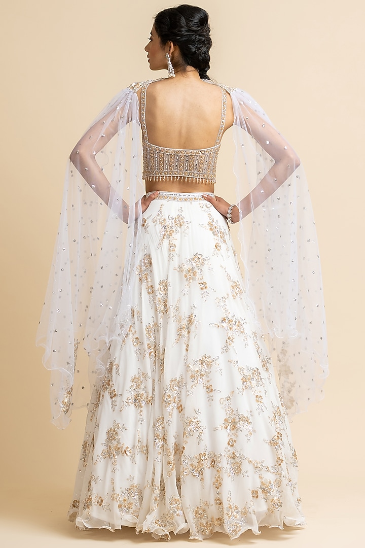 Off-White Net Sequins Embroidered Wedding Lehenga Set by NITIKA GUJRAL at Pernia's Pop Up Shop