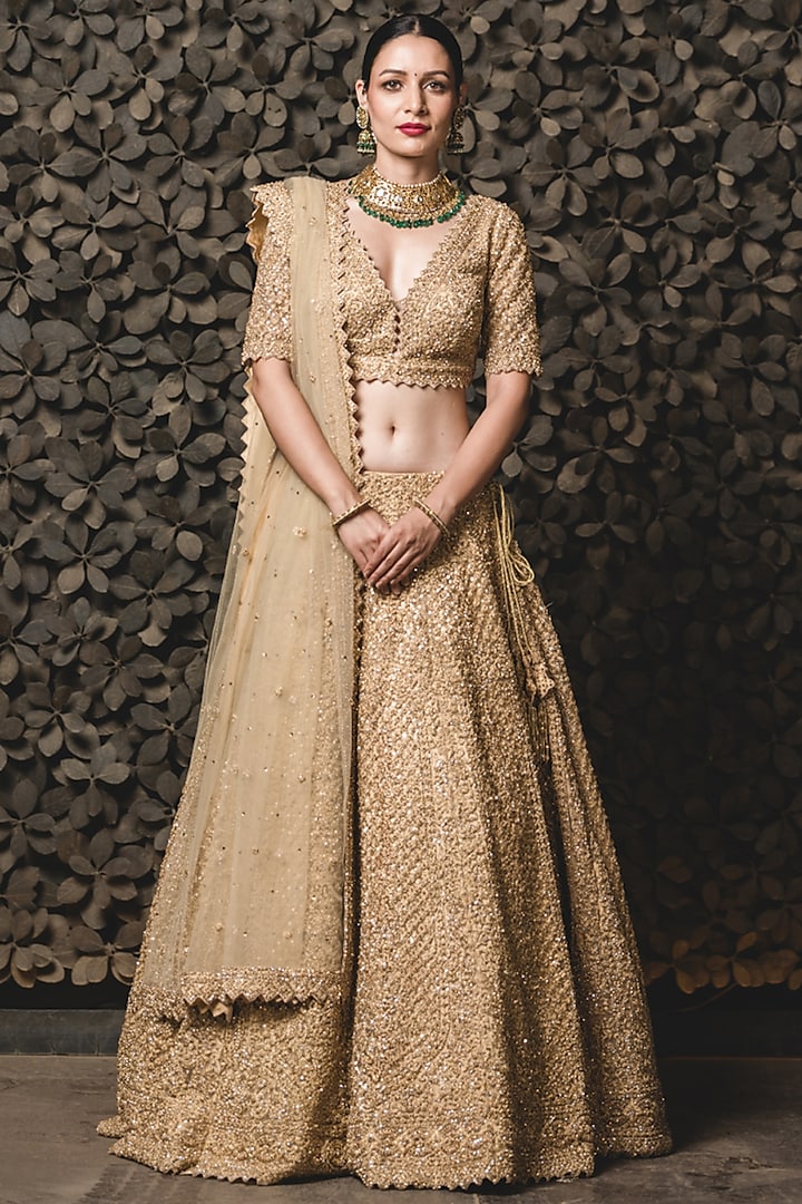 Golden Tulle Crystal Embroidered Lehenga Set by NITIKA GUJRAL