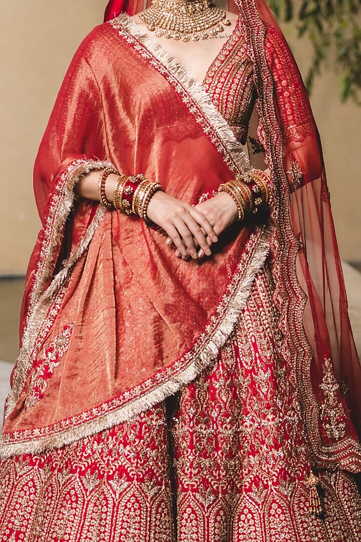 Blood Red Raw Silk Golden Zari Embellished Bridal Lehenga Set by NITIKA GUJRAL at Pernia's Pop Up Shop