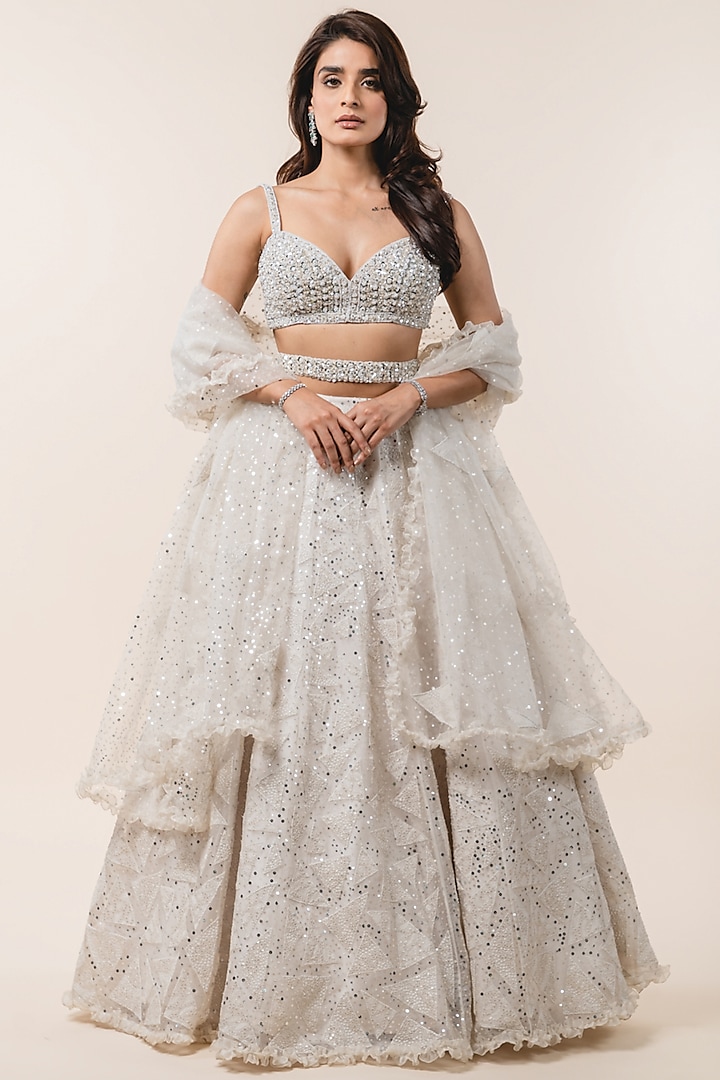 Ivory Organza Sequins Embroidered Lehenga Set by NITIKA GUJRAL