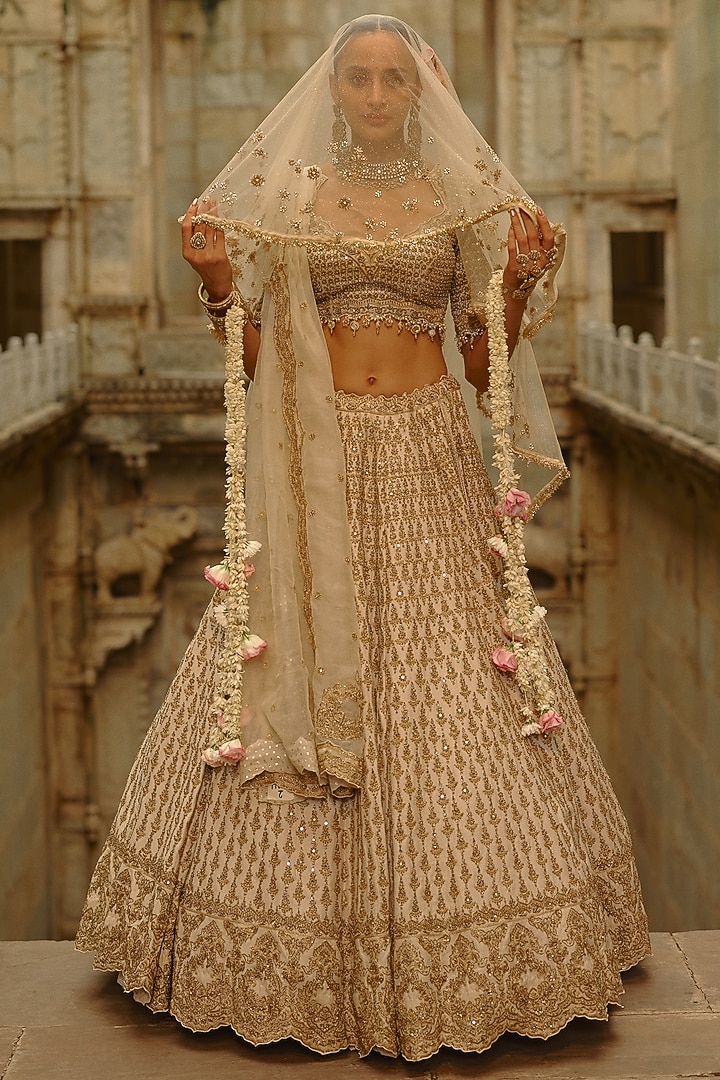 Cream Raw Silk Hand Embroidered Bridal Lehenga Set by NITIKA GUJRAL at Pernia's Pop Up Shop