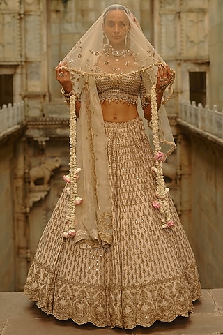 Cream Raw Silk Hand Embroidered Lehenga Set by NITIKA GUJRAL