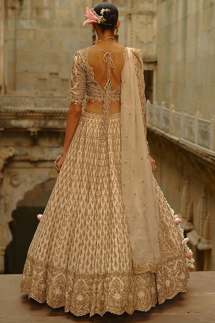Cream Raw Silk Hand Embroidered Bridal Lehenga Set by NITIKA GUJRAL at Pernia's Pop Up Shop
