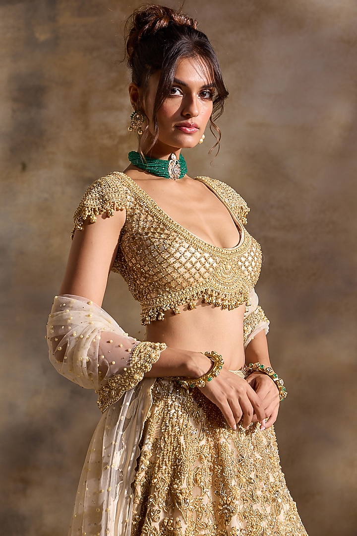 Golden Tulle Beads & Sequins Embroidered Bridal Lehenga Set by NITIKA GUJRAL at Pernia's Pop Up Shop