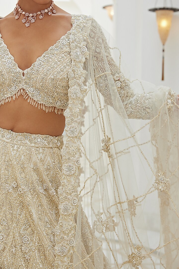 Ivory Net Sequins & Crystal Embroidered Bridal Bridal Lehenga Set by NITIKA GUJRAL at Pernia's Pop Up Shop