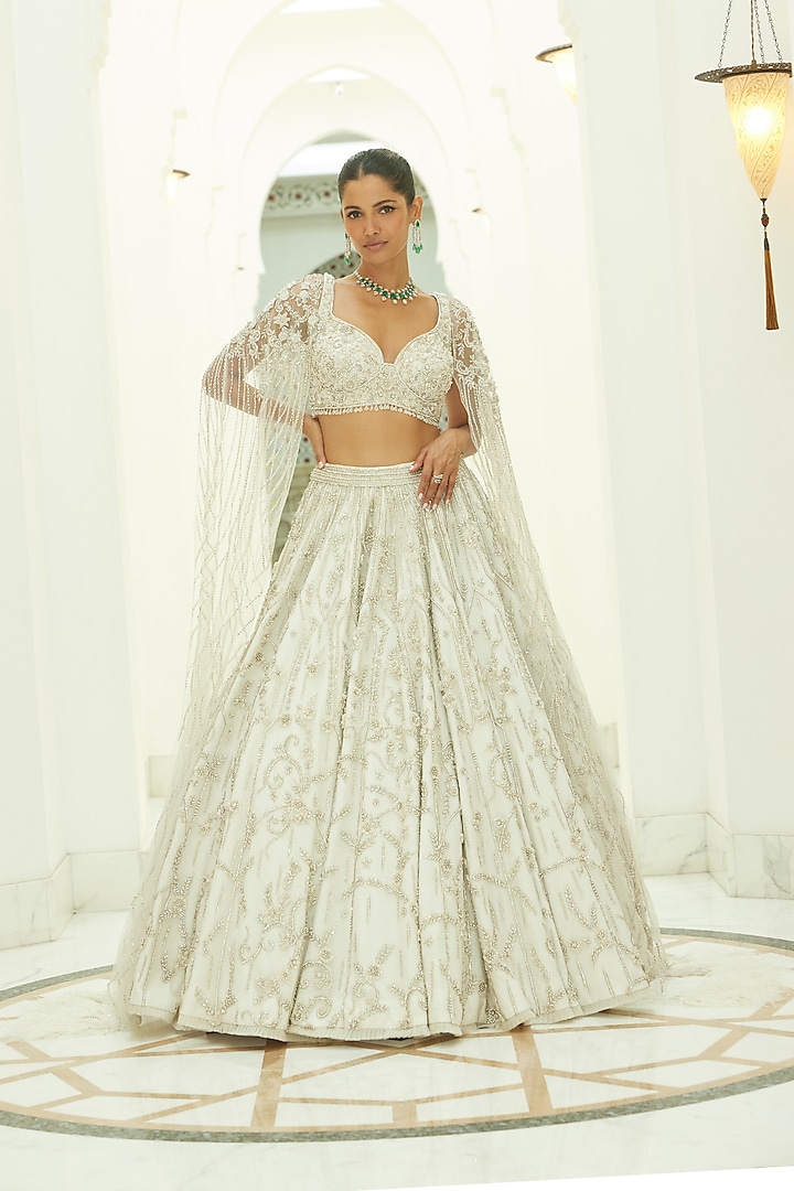 Ivory Net Beads & Sequins Embroidered Bridal Bridal Lehenga Set by NITIKA GUJRAL at Pernia's Pop Up Shop