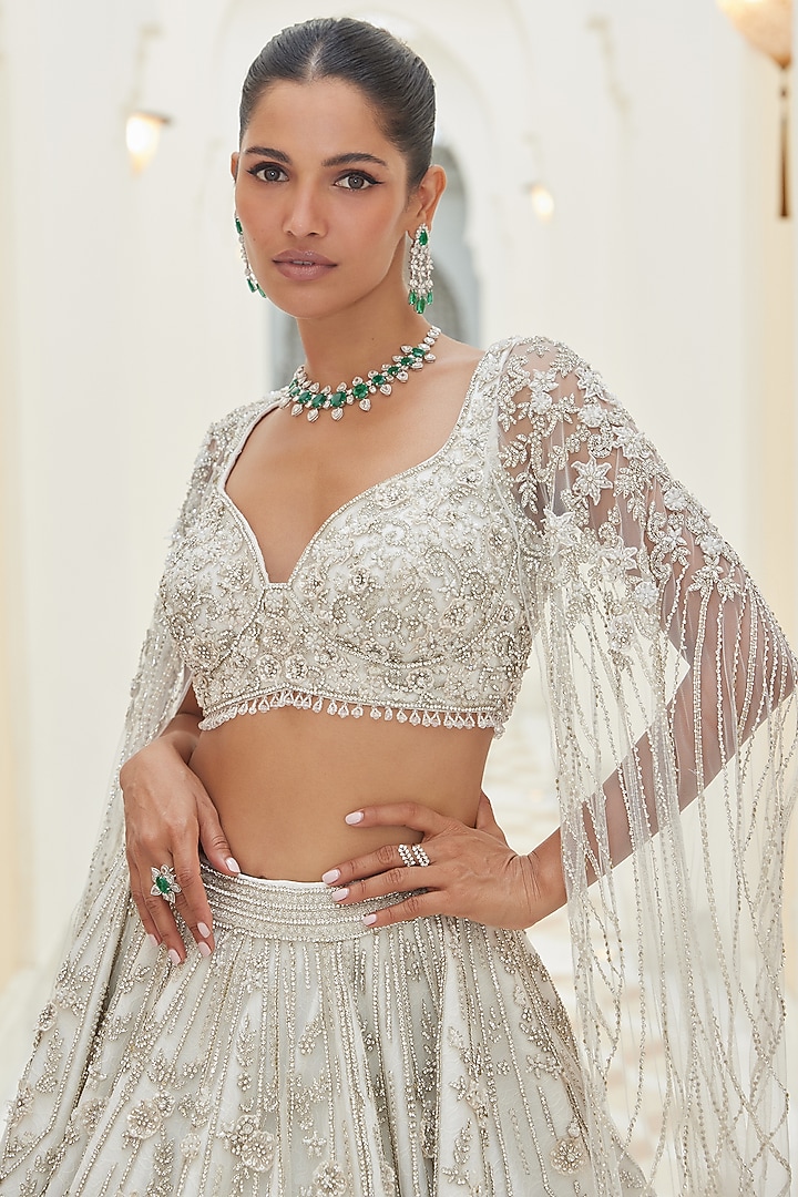 Ivory Net Beads & Sequins Embroidered Bridal Bridal Lehenga Set by NITIKA GUJRAL at Pernia's Pop Up Shop
