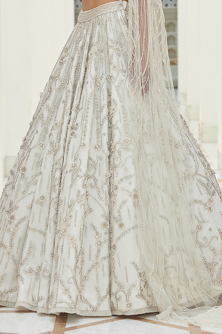 Ivory Net Beads & Sequins Embroidered Bridal Bridal Lehenga Set by NITIKA GUJRAL at Pernia's Pop Up Shop