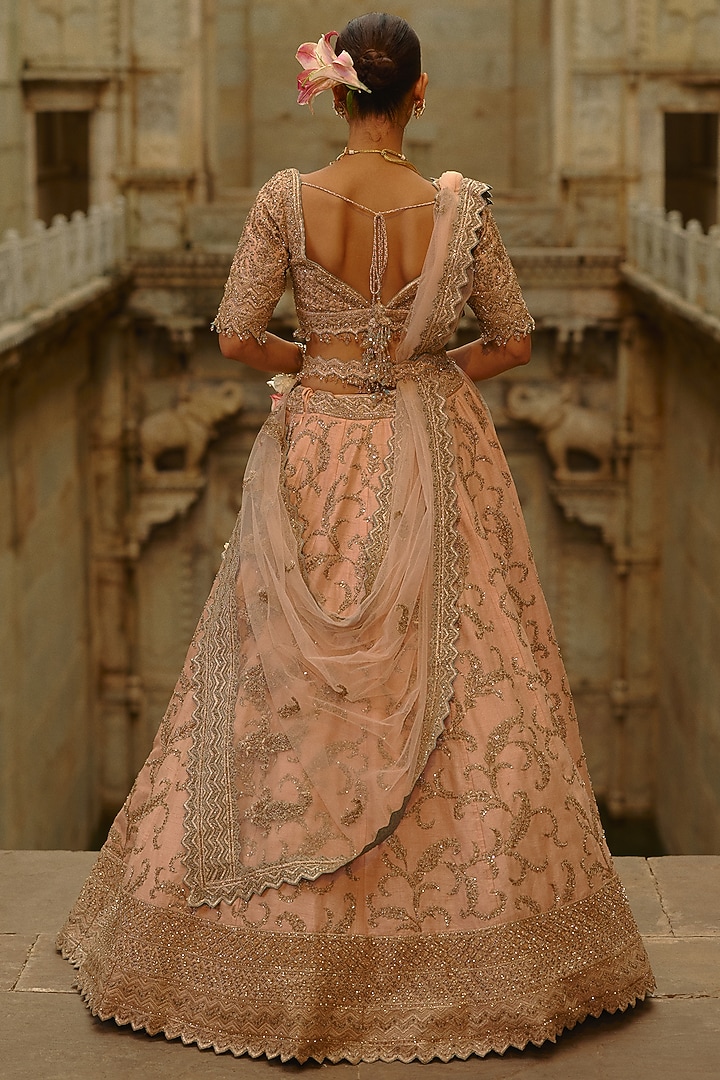 Peach Raw Silk Sequins Embroidered Bridal Lehenga Set by NITIKA GUJRAL at Pernia's Pop Up Shop