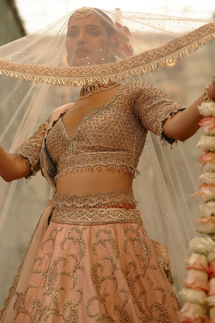 Peach Raw Silk Sequins Embroidered Bridal Lehenga Set by NITIKA GUJRAL at Pernia's Pop Up Shop