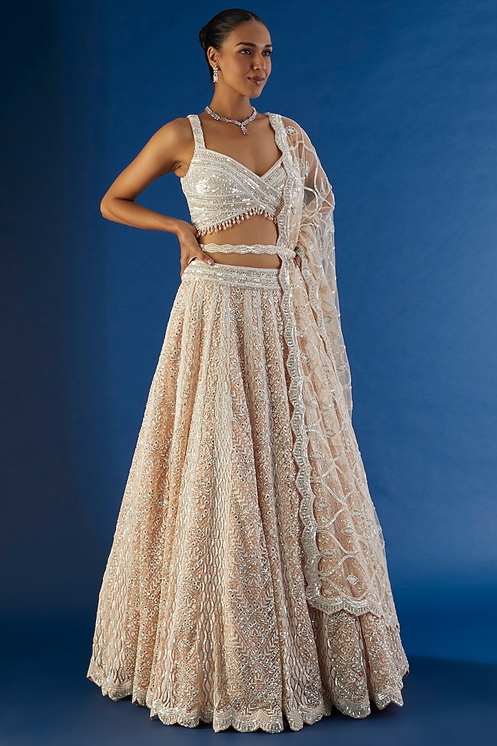 Peach Tulle Sequins Embroidered Bridal Lehenga Set by NITIKA GUJRAL at Pernia's Pop Up Shop