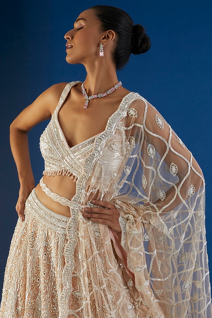 Peach Tulle Sequins Embroidered Bridal Lehenga Set by NITIKA GUJRAL at Pernia's Pop Up Shop