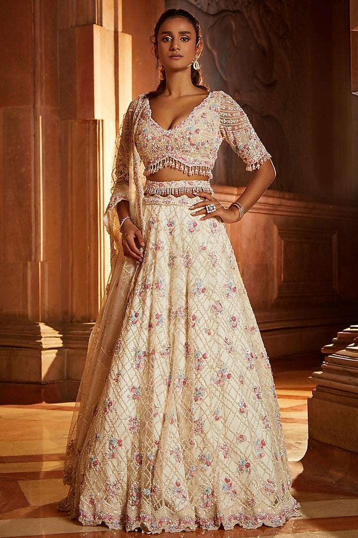 Ivory Tulle Sequins Embroidered Bridal Lehenga Set by NITIKA GUJRAL at Pernia's Pop Up Shop