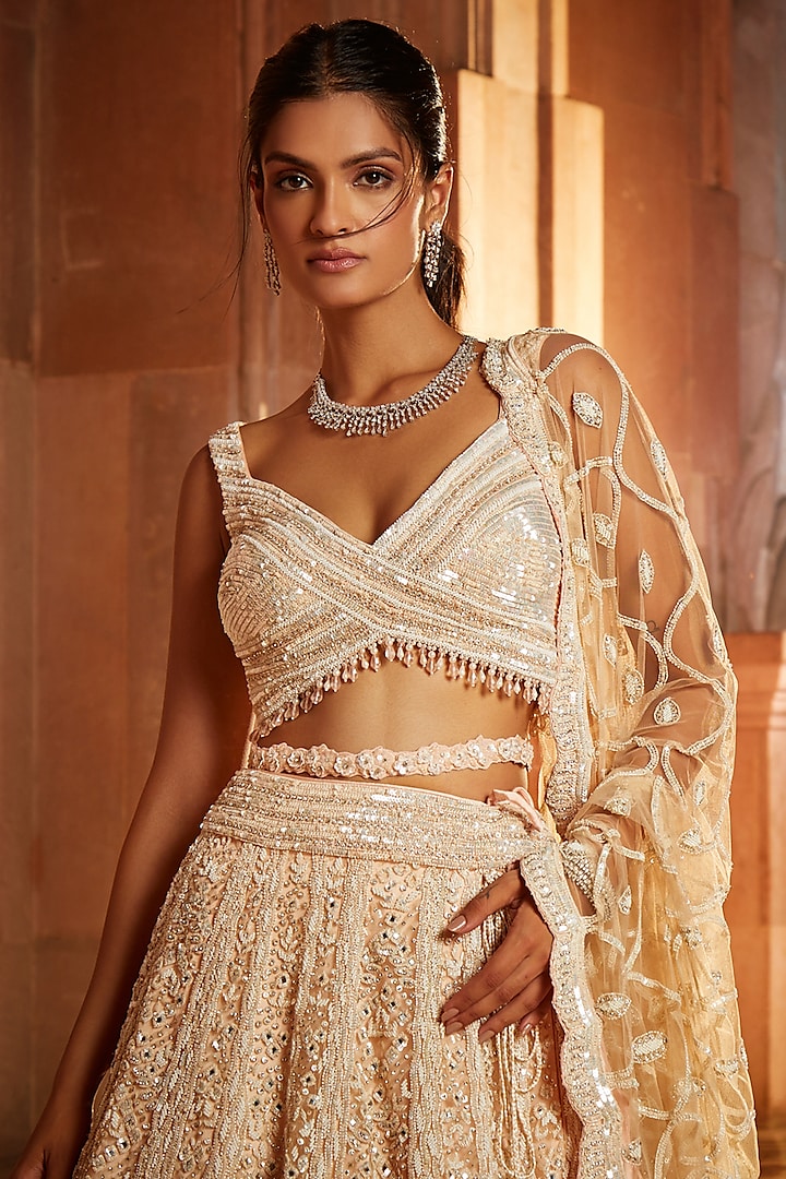 Nude Pink Tulle Sequins Embroidered Bridal Lehenga Set by NITIKA GUJRAL at Pernia's Pop Up Shop