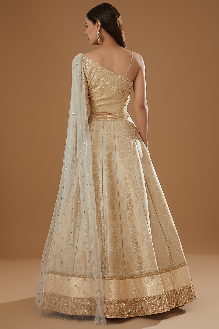 Cream Brocade & Net Wedding Lehenga Set by NITIKA GUJRAL at Pernia's Pop Up Shop
