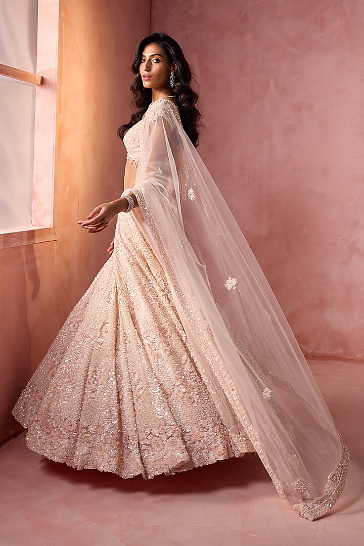 Blush Pink Tulle Sequins Embroidered Bridal Lehenga Set by NITIKA GUJRAL at Pernia's Pop Up Shop