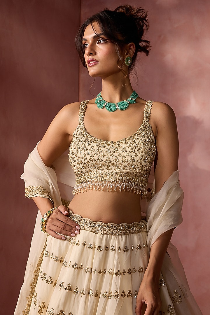 Cream Organza Sequins & Crystal Embroidered Bridal Lehenga Set by NITIKA GUJRAL at Pernia's Pop Up Shop