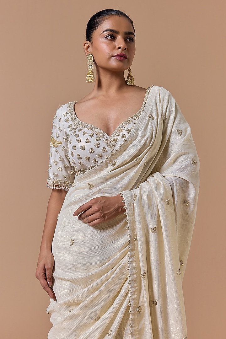 Cream & Gold Georgette Lurex Sequins Embroidered Reception Saree Set by NITIKA GUJRAL at Pernia's Pop Up Shop