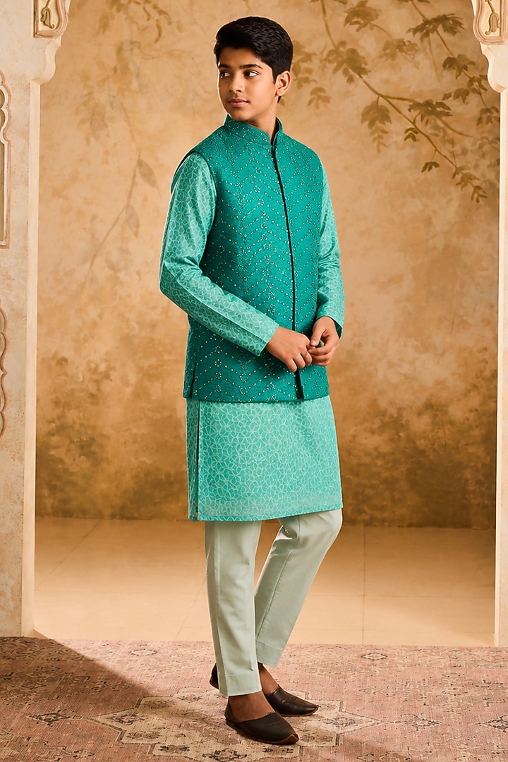 Teal Raw Silk Resham & Mirror Embroidered Bundi Jacket Set For Boys by Nitika Gujral Kids at Pernia's Pop Up Shop