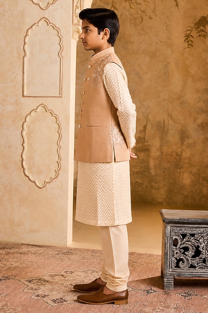 Beige Linen 3D Floral Embroidered Bundi Jacket Set For Boys by Nitika Gujral Kids at Pernia's Pop Up Shop