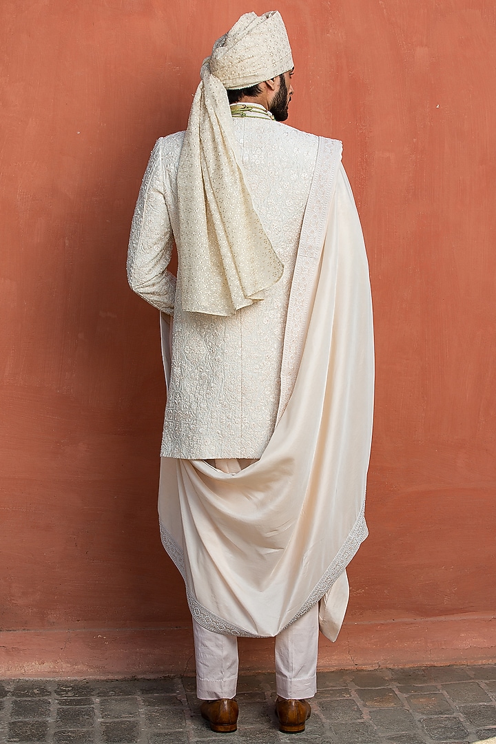 Ivory Raw Silk Embroidered Groom Sherwani Set by NITIKA GUJRAL MEN at Pernia's Pop Up Shop