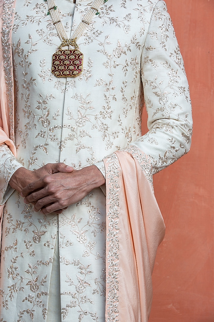 Ivory Raw Silk Embroidered Groom Sherwani Set by NITIKA GUJRAL MEN at Pernia's Pop Up Shop