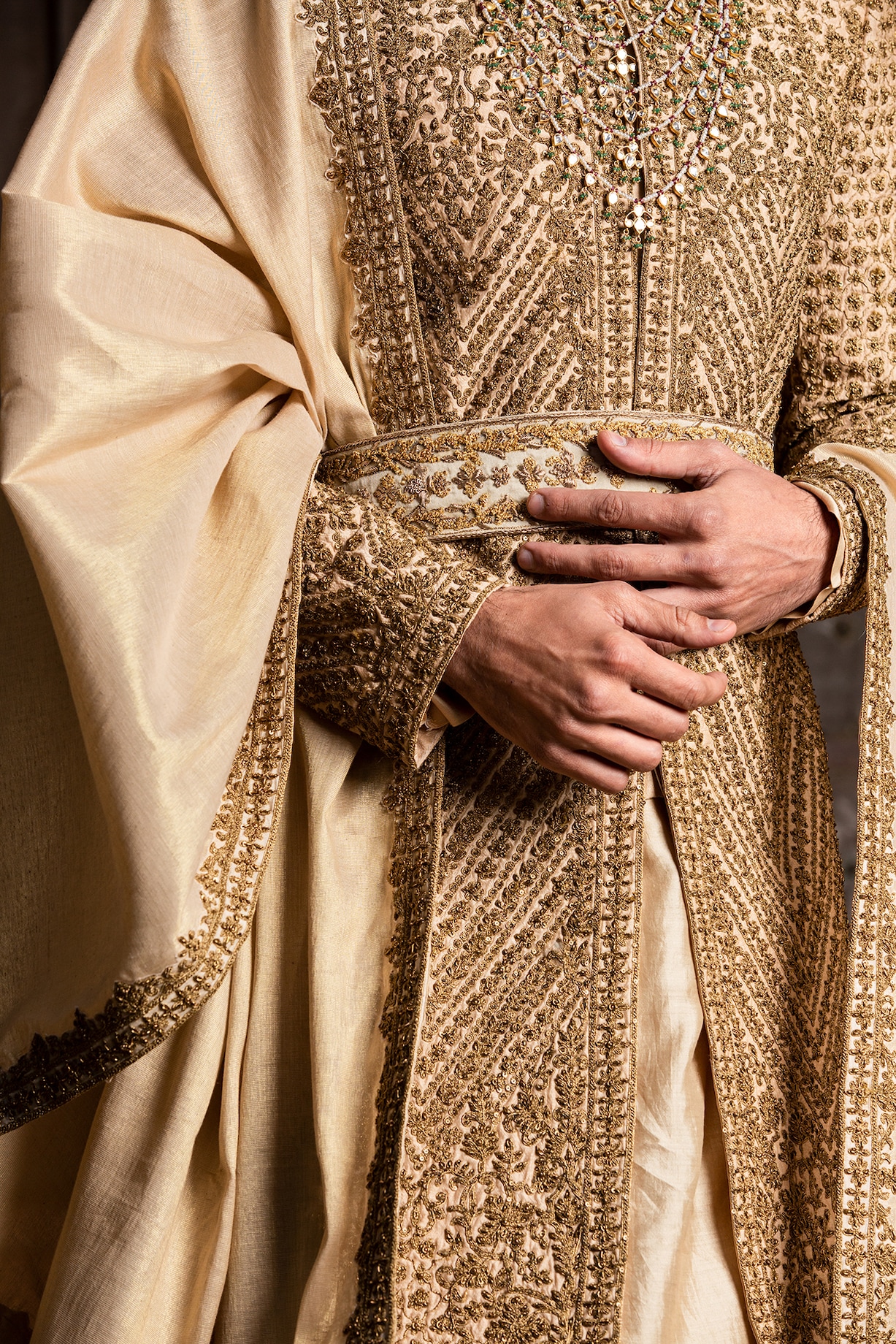 Gold Raw Silk Dabka Embroidered Groom Sherwani Set by NITIKA