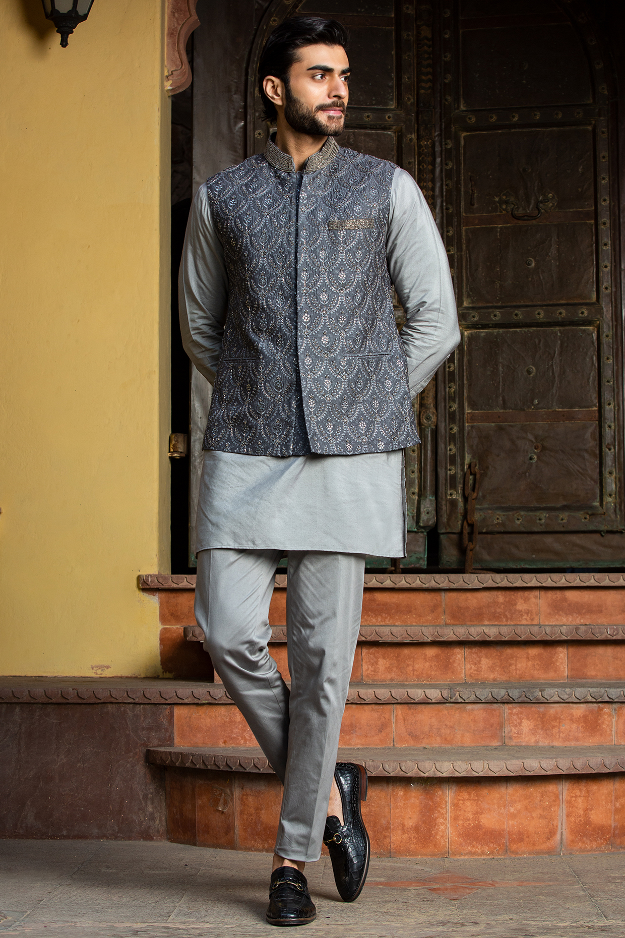 Charcoal Raw Silk Bundi Jacket With Kurta Set by NITIKA GUJRAL MEN