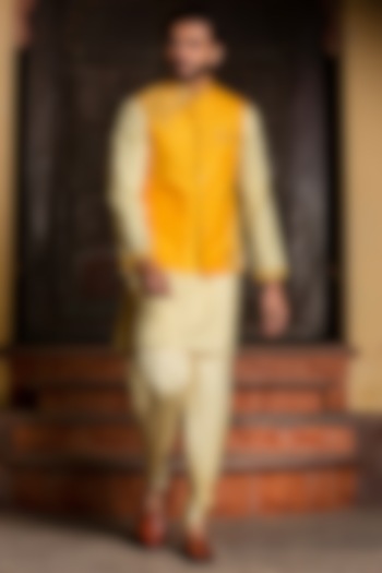 Yellow Raw Silk Jacket With Kurta Set by NITIKA GUJRAL MEN