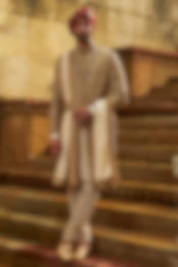 Gold Dupion Silk Cutdana Embroidered Sherwani Set by NITIKA GUJRAL MEN